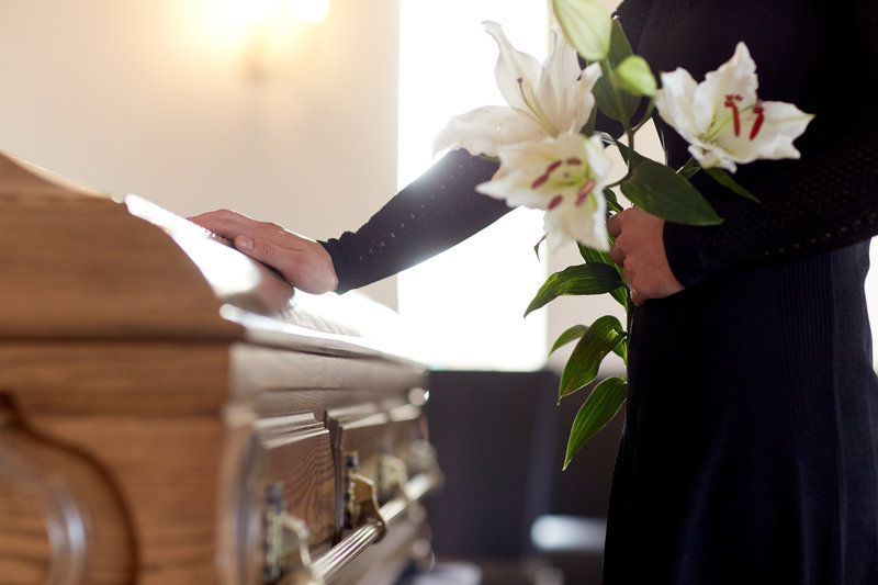 Touching coffin at funeral - Australian law firm