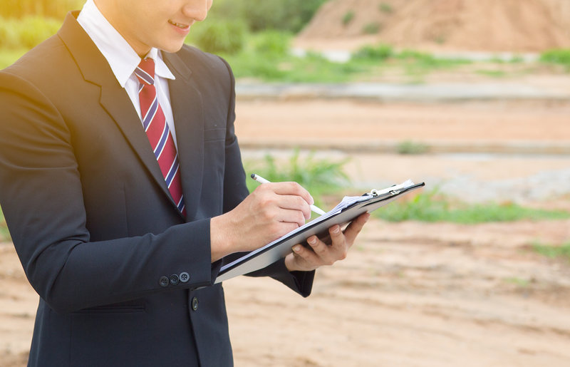 Professional gentleman signing conveyancing papers